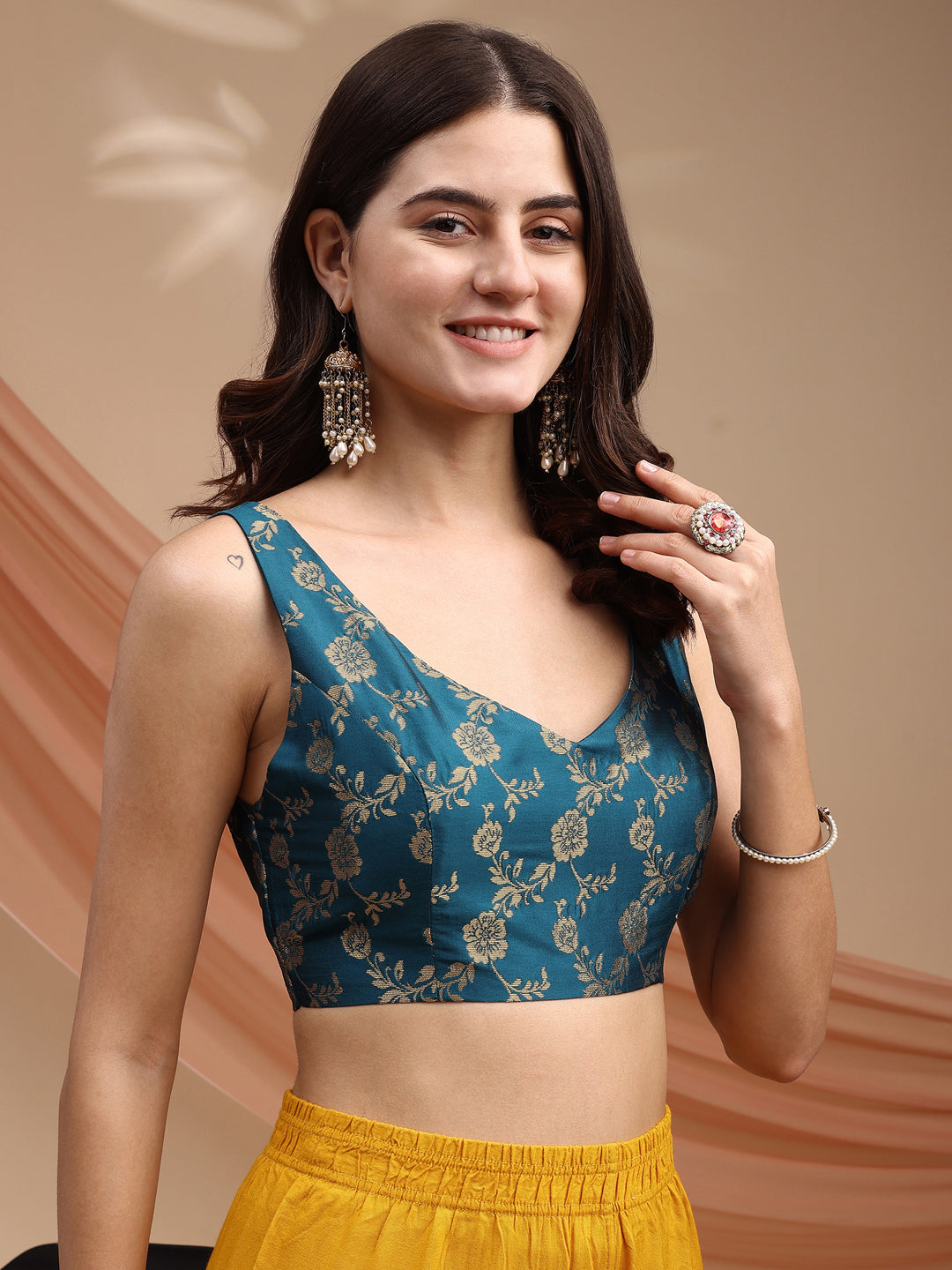 Teal colour brocade sleeveless blouse